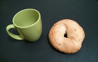 A topologist is someone who cannot tell the difference between a coffee mug and a donut.  Or bagel, in this case.